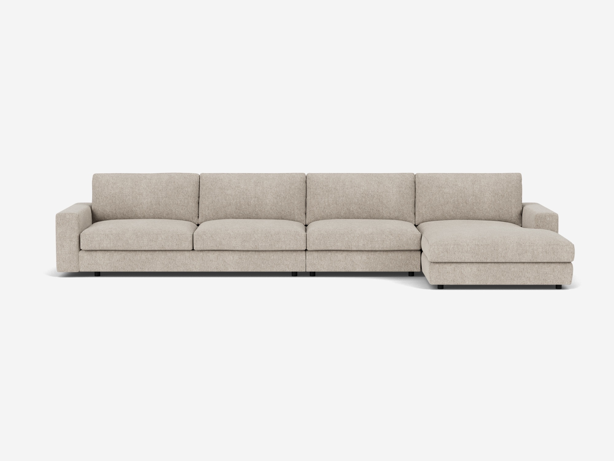 Front view of the modular sofa in light grey fabric with right hand chaise